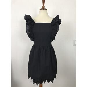 The KNLs Ruffled Crochet Trim Tie Back Mini Dress